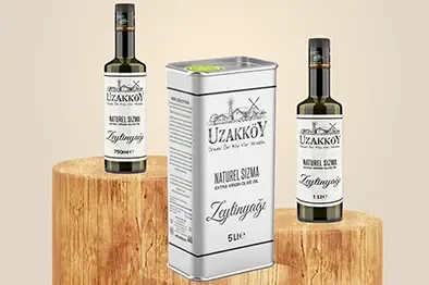 Uzakköy extra virgin olive oil bottles and tin